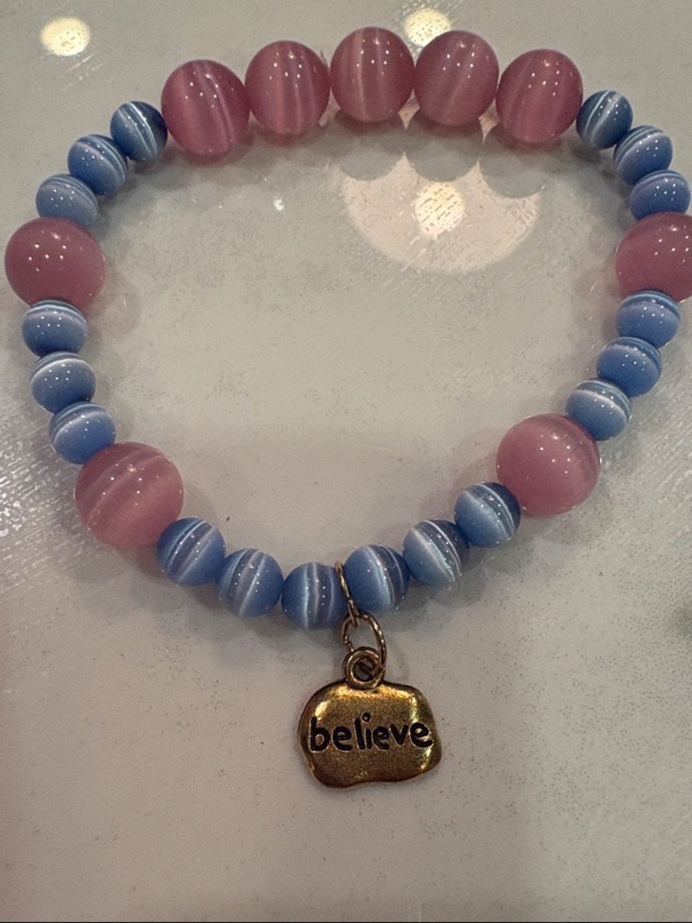 OKO designs cats eye glass believe stretch bracelet